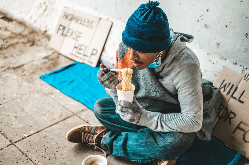 beggars-sat-wrapped-cloths-eating-noodles