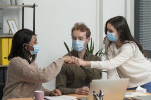 people-with-medical-masks-working-together-project