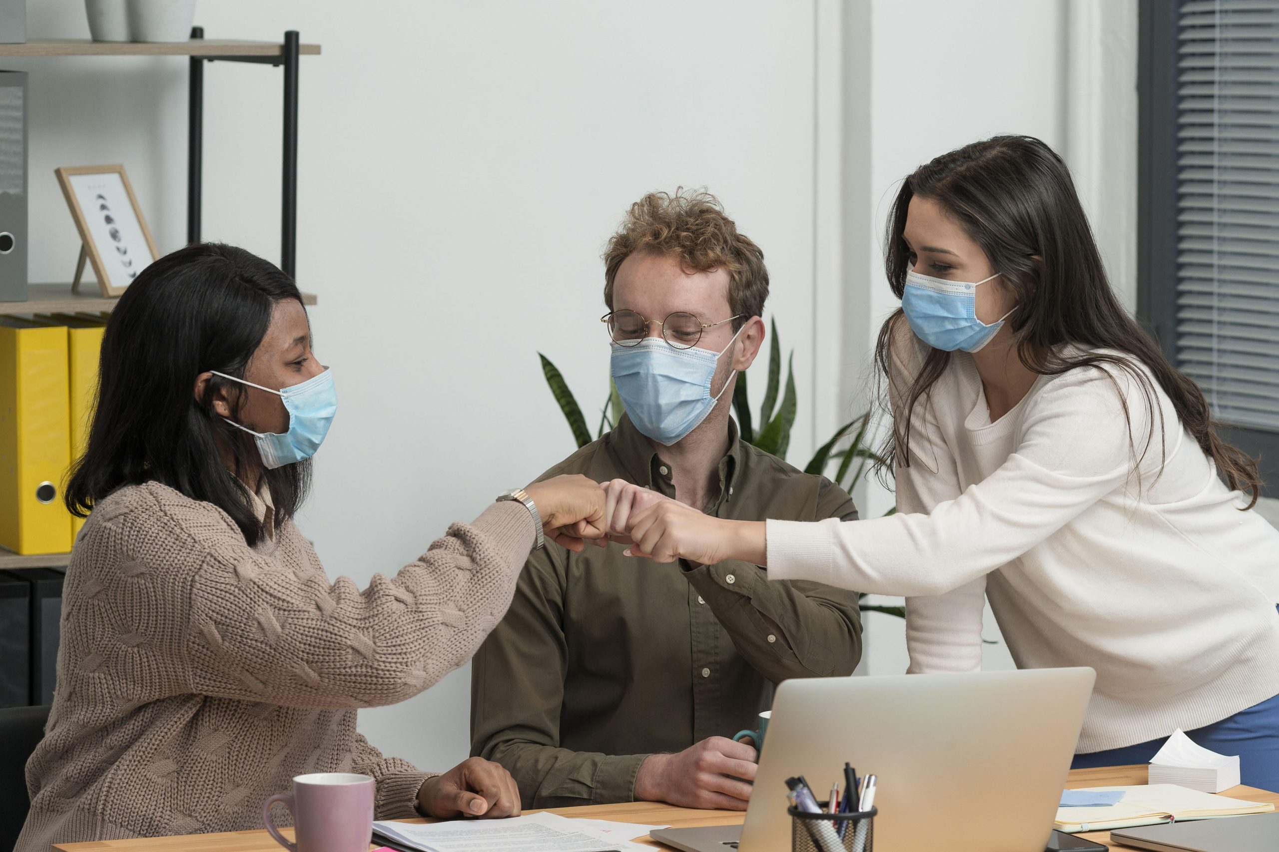 people-with-medical-masks-working-together-project